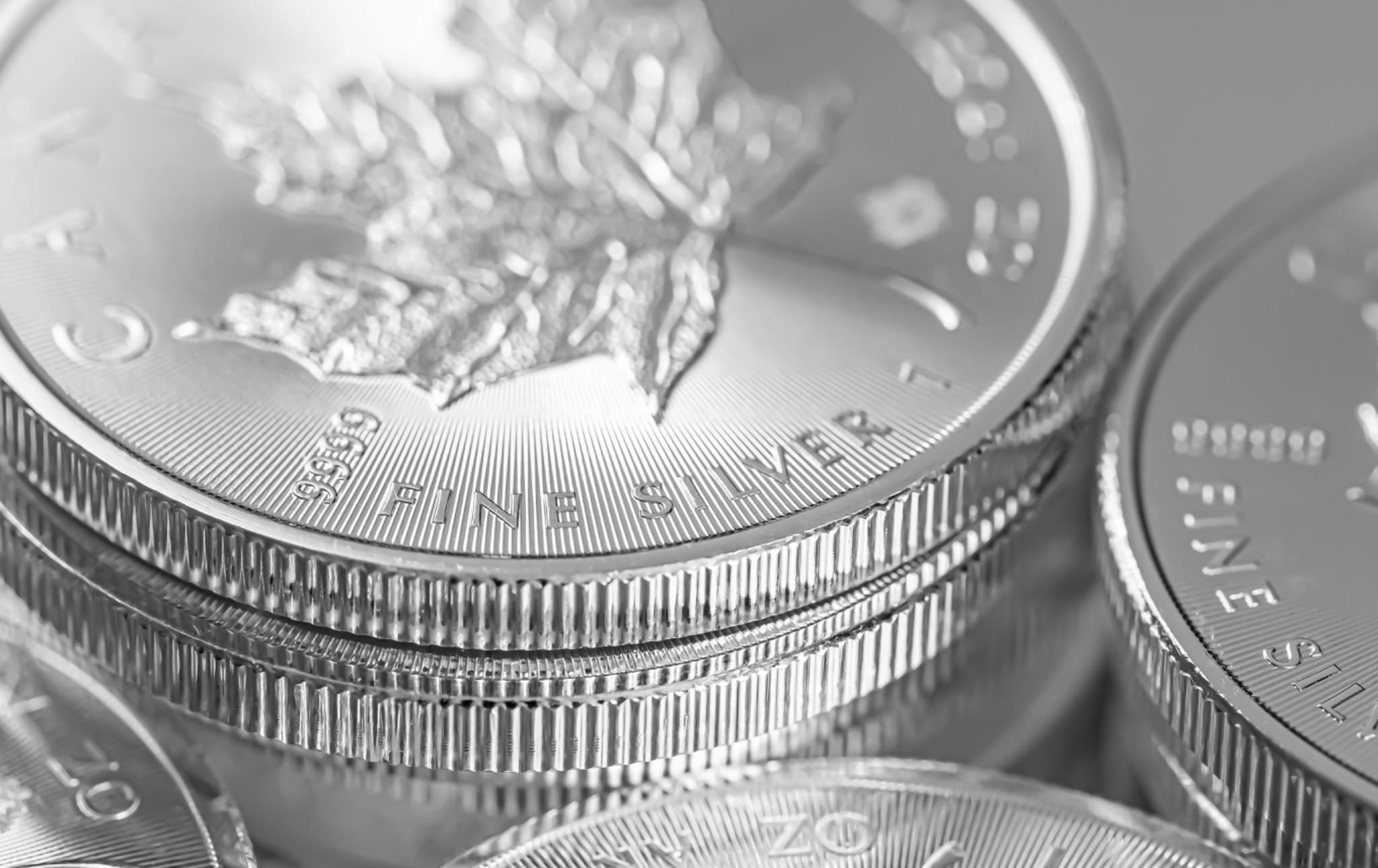 Closeup of silver coins from a mint Closeup of silver coins from a mint