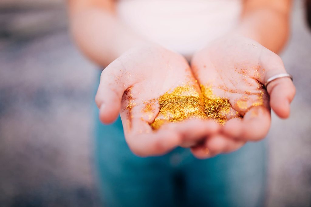Gold dust in open hands