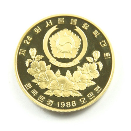 1988 Gold 1oz Gold South Korea 50,000 Won coin. Pul Guk Temple. Image of 1988 Gold 1oz Gold South Korea 50,000 Won coin. Pul Guk Temple.